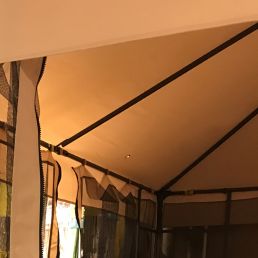 Canopy cover for LEAF 3x3m awning, light brown, slightly sloped, mounted on a sturdy metal frame.