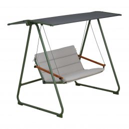 Green two-seater garden swing with a gray fabric seat and a sunshade, metal frame.