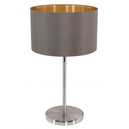 Lauavalgusti, millel on hõbedane jalg ja tumehall varjund kuldse sisemusega.