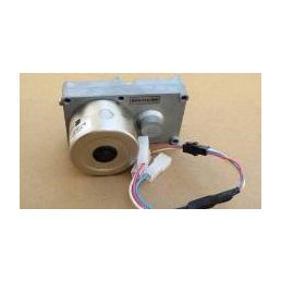 Gray metal pellet feeder motor connected via a multicolored cable. Used in Minitherm AQUA and Minitherm 8 devices.