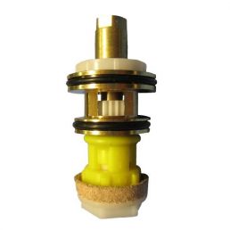 Yellow and gold parts, a mix of metal and plastic components, part of a flushing system, round shape.