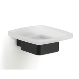 Valge ruudukujuline valamu musta alusega, minimalistlik disain.