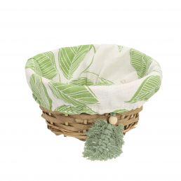 Ümmargune punutud korv, mille sisuks on lehemustriga valge ja roheline kangas ning küljes roheline tutt.