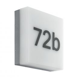 White wall light with the numbers '72b'. Equipped with a DAY&NIGHT sensor for automatic lighting adjustment.