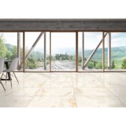 A spacious room with large windows and a mountain view, featuring beige marble-patterned ceramic floor tiles.