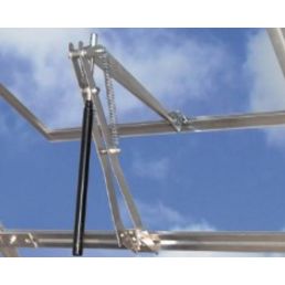 Automatisk öppnare i metall för ventilationslucka, silverfärgad, monterad på ett glastak.