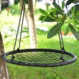 Black swing with a spider-web design, suspended by four sturdy ropes.