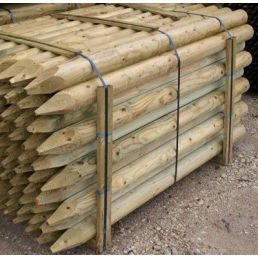 Bundle of wooden round fence posts with pointed ends. Available in lengths from 1.8 to 3 meters, tied with a metal strap.