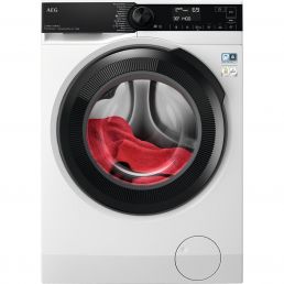 A white front-loading washing machine with a black circular door, with red and white clothes visible inside, and a black control panel at the top.