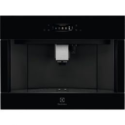 Built-in black coffee machine with a central nozzle, a control panel above, and a smooth glass surface.