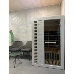 White infrared sauna for two, measuring 1200x1150x1900 mm, with a glass door and ventilation slats.
