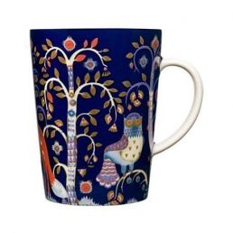 Blue Iittala Taika mug, 0.4 liters, adorned with a magical pattern featuring birds and plants.