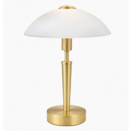 Messingist lauavalgusti koos valge kupliga ja ümmarguse alusega.