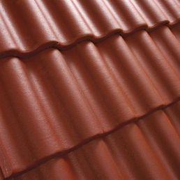 Punane laineline katusekivi tagab hea vihmavee äravoolu ja vastupidavuse ilmastikutingimustele.