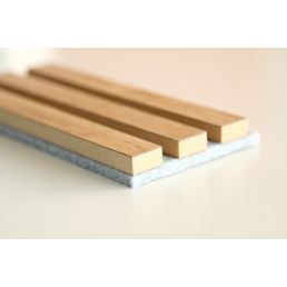 Light oak-colored acoustic rib panel covered with light gray felt.