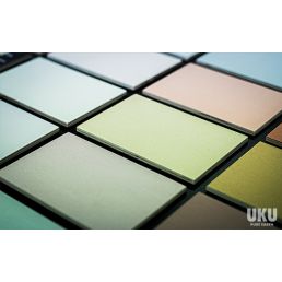 Ceramic tiles in various pastel shades, arranged diagonally.