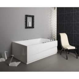 A white bathtub with black trim and an integrated faucet system is set in a modern bathroom with granite floors.