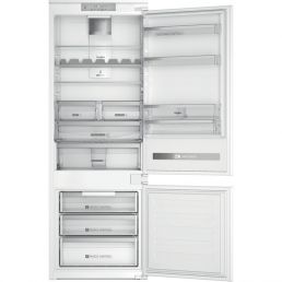 White integrated Whirlpool refrigerator with a separate freezer compartment, glass shelves, and drawers.